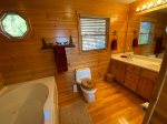 Loft Master Bathroom with a Large Shower Stall and Jetted Garden Tub